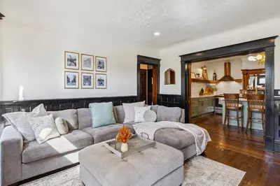 a living room with a couch and a table at Meerkat Manor- 5 Min Drive to CLE Clinic in Cleveland