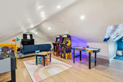 a living room filled with furniture and a play table at Meerkat Manor- 5 Min Drive to CLE Clinic in Cleveland