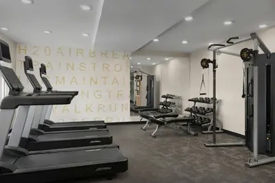a gym with treadmills and machines in a room at Residence Inn by Marriott Dayton Miamisburg in Miamisburg