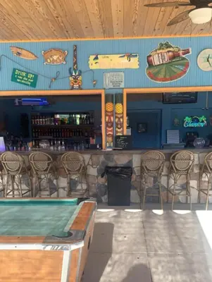 a bar in a restaurant with a counter and chairs at Beverly Hills Inn in Aberdeen