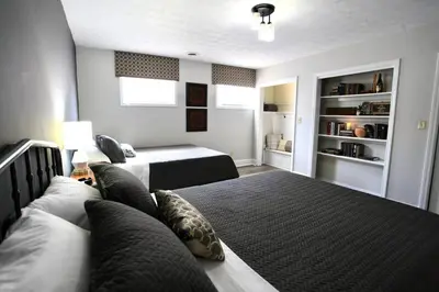 a large bedroom with two beds and a couch at The Lounge - Downtown Chillicothe in Chillicothe