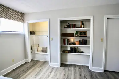 an empty room with white shelves and a window at The Lounge - Downtown Chillicothe in Chillicothe