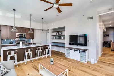 an open kitchen and living room with a ceiling fan at Top Rated - Free Parking - 1-br Condo OTR in Cincinnati