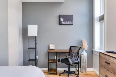 a bedroom with a desk and a chair at Top Rated - Free Parking - 1-br Condo OTR in Cincinnati