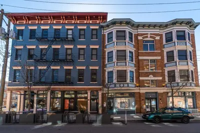 a building with a car parked in front of it at Top Rated - Free Parking - 1-br Condo OTR in Cincinnati