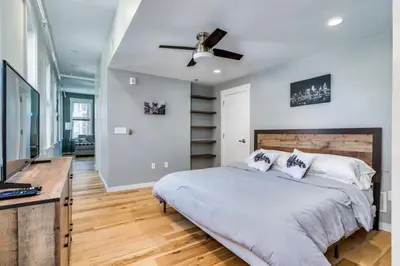 a bedroom with a bed and a ceiling fan at Top Rated - Free Parking - 1-br Condo OTR in Cincinnati