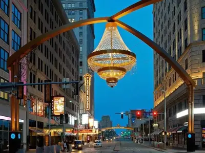 a large chandelier hanging over a city street at night at Stylish King Bed, 2BDRM, 1 Mile to DTWN, Game Room in Cleveland