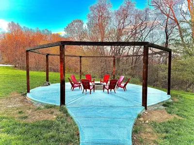 a gazebo with chairs and a table in the grass at Cozy retreat on private estate with Hot Tub in Lancaster