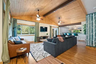 a living room with two couches and a tv at Cozy retreat on private estate with Hot Tub in Lancaster