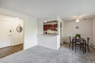 a kitchen and dining room with a table and chairs at Scenic towers 3012 I Cozy & Comfy I Free Parking in Parma