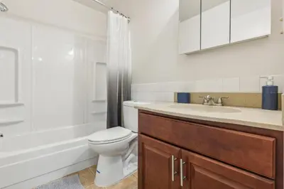 a bathroom with a toilet and a sink and a tub at Scenic towers 3105I Cozy & Comfy I Free Parking in Parma