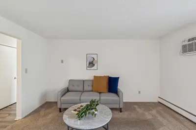 a living room with a couch and a table at Scenic towers 3217I Cozy & Comfy I Free Parking in Parma