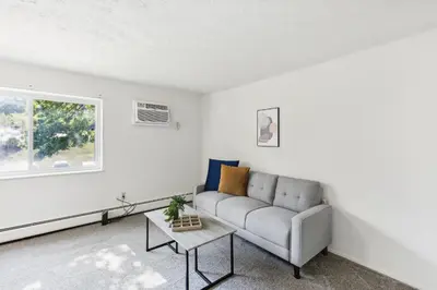 a living room with a couch and a table at Midtown 3229I Cozy & Comfy I Free Parking in Parma