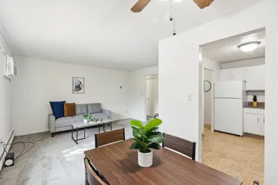 a kitchen and living room with a table and a couch at Midtown 3229I Cozy & Comfy I Free Parking in Parma