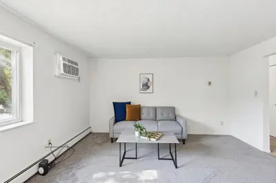 a living room with a couch and a table at Midtown 3229I Cozy & Comfy I Free Parking in Parma