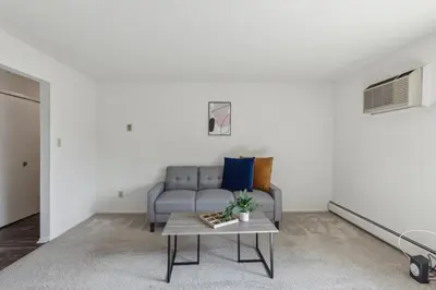 a living room with a couch and a table at Midtown 3402I Cozy & Comfy I Free Parking in Parma