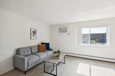 a living room with a couch and a window at Midtown 3602I Cozy & Comfy I Free Parking in Parma
