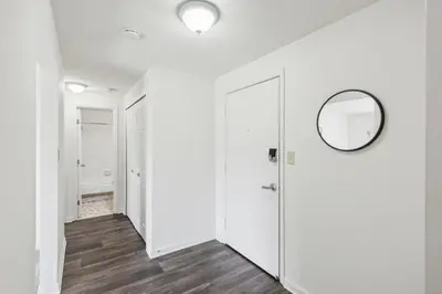 a hallway with a door and a mirror at Midtown 3603 I Cozy & Comfy I Free Parking in Parma