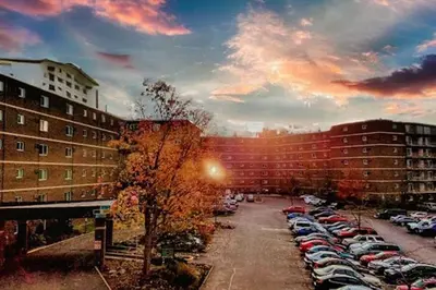 a parking lot with cars parked in a parking lot at Midtown 3603 I Cozy & Comfy I Free Parking in Parma