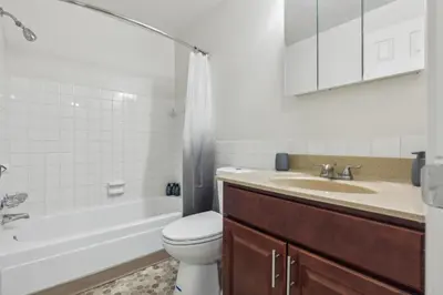 a bathroom with a toilet and a sink and a tub at Midtown 3603 I Cozy & Comfy I Free Parking in Parma
