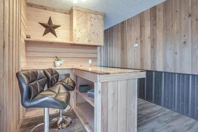 a home office with a desk and a leather chair at Downtown Condo about 23 Mi to Hocking Hills State Park in Lancaster