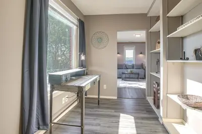 a hallway with a table and a window at Downtown Condo about 23 Mi to Hocking Hills State Park in Lancaster