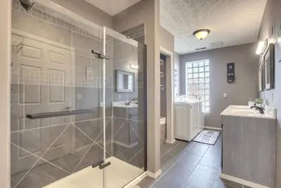 a bathroom with a shower and a sink at Downtown Condo about 23 Mi to Hocking Hills State Park in Lancaster
