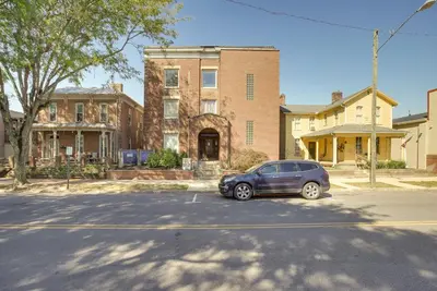 a car parked in a parking lot in front of a building at Downtown Condo about 23 Mi to Hocking Hills State Park in Lancaster