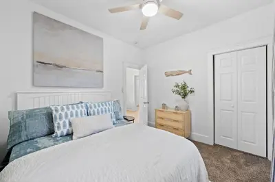 a bedroom with a bed and a ceiling fan at Comfortable 2-Bedroom House In Cleveland 1330 in Cleveland