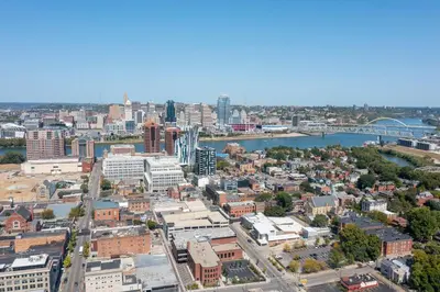 an aerial view of a city with a river and buildings at Top-Rated 1BR Near Convention Center & Parking in Covington