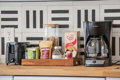 a coffeemaker sitting on a counter with a coffee maker at Top-Rated 1BR Near Convention Center & Parking in Covington