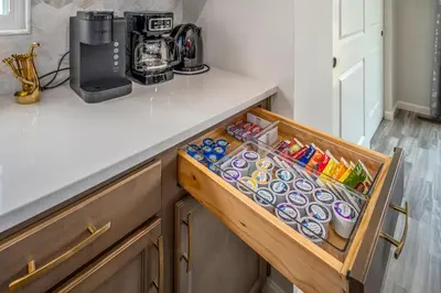 a kitchen counter with a drawer filled with food at Full Home by Ark and Creation Museum in Walton