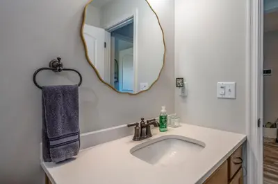 a bathroom with a sink and a mirror at Full Home by Ark and Creation Museum in Walton