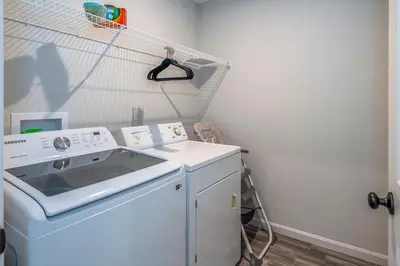 a washer and dryer in a laundry room at Full Home by Ark and Creation Museum in Walton