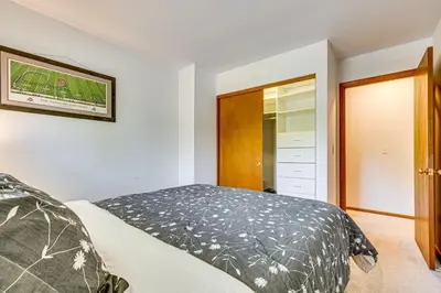 a bedroom with a bed and a closet at 11 Mi to Dtwn Columbus Group Retreat with Fire Pit! in Worthington