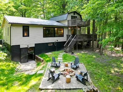an aerial view of a house in the woods at Game RoomHot Tub4mi to Rock HouseGives Back! in Laurelville
