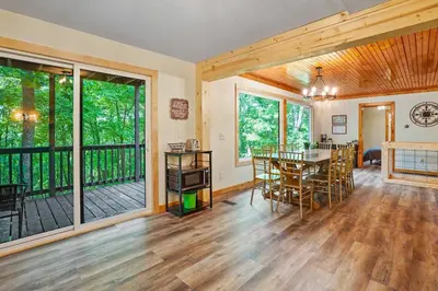 an open living room with a table and chairs at Game RoomHot Tub4mi to Rock HouseGives Back! in Laurelville