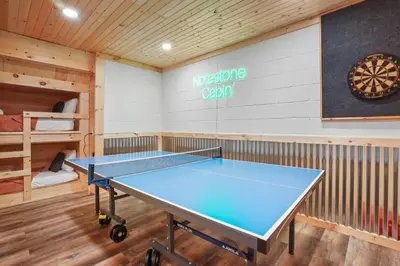 a ping pong room with a ping pong table at Game RoomHot Tub4mi to Rock HouseGives Back! in Laurelville