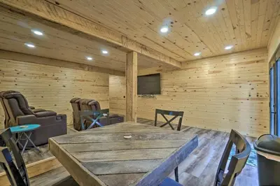 a room with a large wooden table and chairs at Game Room6mi to parksGroup GetawayGives Back! in Logan
