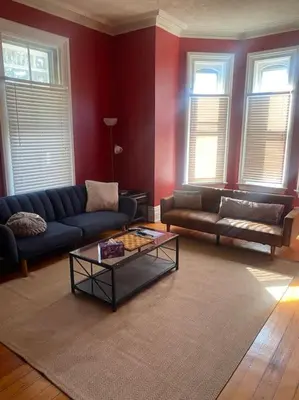 a living room with a couch and a coffee table at Victorian Getaway in Cincinnati