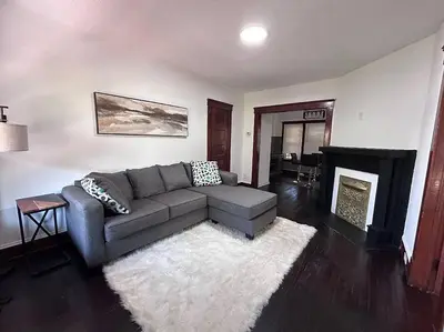a living room with a couch and a fireplace at 2Bed Apt Near University Hospital in East Cleveland