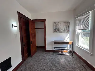 an empty room with a table and a window at 2Bed Apt Near University Hospital in East Cleveland