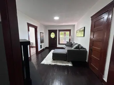 a living room with a couch and a door at 2Bed Apt Near University Hospital in East Cleveland