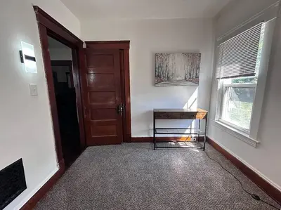 a room with a door and a table and a window at 2Bed Apt Near University Hospital in East Cleveland
