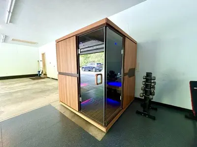 a room with a glass door with a car outside at 12,700 sf 8 Room Mansion on 18 acres in Medina