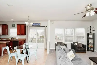 a living room with a couch and a table at Modern Retreat near downtown Dayton in Dayton