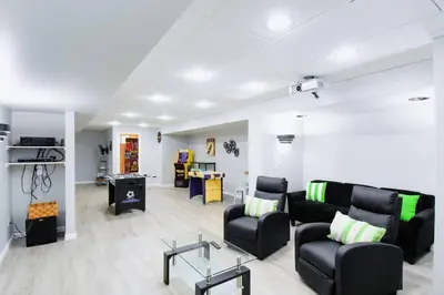 a living room with a couch and chairs and a table at Modern Retreat near downtown Dayton in Dayton