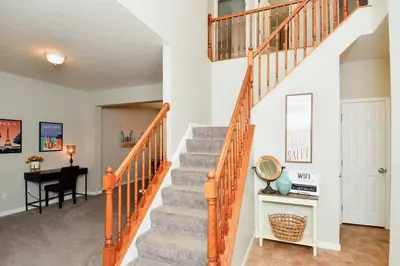 a staircase in a home with a desk at Modern Retreat near downtown Dayton in Dayton