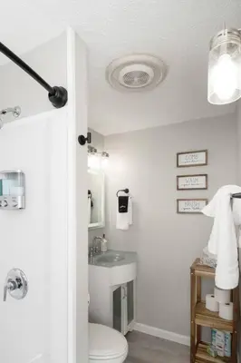 a bathroom with a toilet and a sink at Sunny Ranch - Newly Remodeled in Dayton
