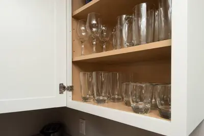 a cupboard filled with lots of empty wine glasses at Sunny Ranch - Newly Remodeled in Dayton